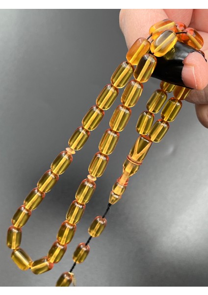 Ateş Kehribar Tesbih Sarı Kapsül Model 7X11MM 33 Tane Sistemli Tane Boşlukları Ayarlanabilir Püskül AK04075.180324