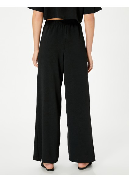 Bol Paça Pantolon Kapaklı Bağlama Detaylı Beli Lastikli fırsatları