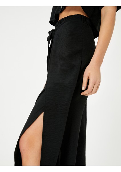 Bol Paça Pantolon Kapaklı Bağlama Detaylı Beli Lastikli indirimleri