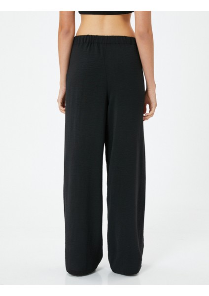 Etekli Pantolon Kruvaze Bağlama Detaylı Bol Paça fırsatları