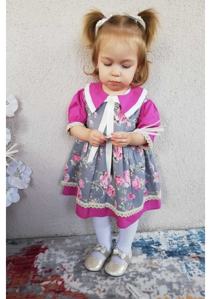 Kurdele ve Dantel Detaylı Çiçek Desenli Menekşe Renk Kız Çocuk Bebek Elbise