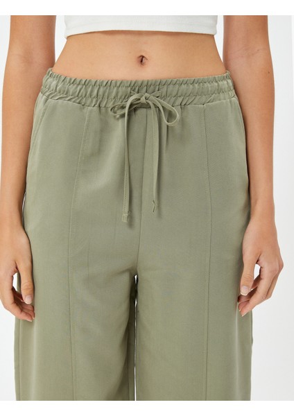 Havuç Pantolon Beli Bağcıklı Normal Bel Cep Detaylı Modal indirimleri