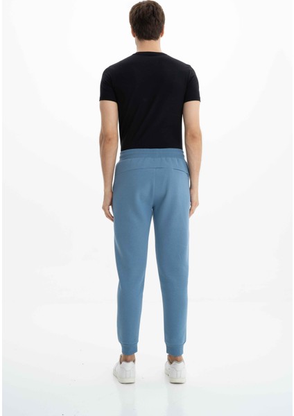 Erkek Regular Fit Cepli Arka Cep Fermuarlı Basic 3 İplik Şardonlu Dar Paça Lastikli Eşofman Altı K26174680001