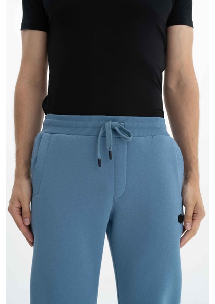 Erkek Regular Fit Cepli Arka Cep Fermuarlı Basic 3 İplik Şardonlu Dar Paça Lastikli Eşofman Altı K26174680001