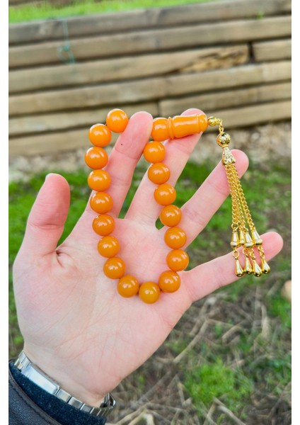 Küre Tane Turuncu Gold Püsküllü 17'lik Sıkma Kehribar Tesbih