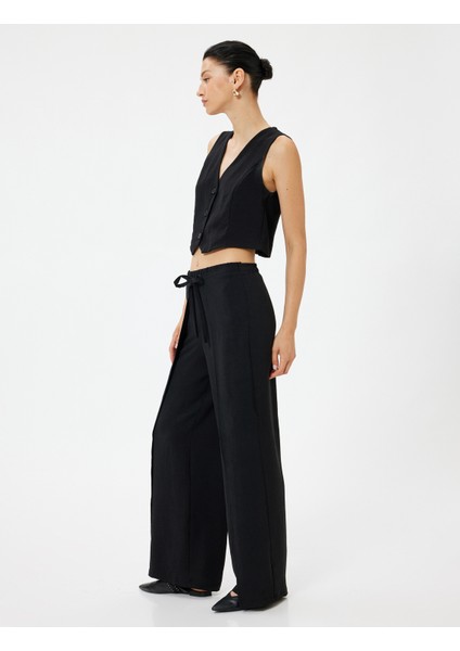 Yandan Kapak Detaylı Bol Paça Pantolon Bağlamalı Aerobin Kumaş fiyatları