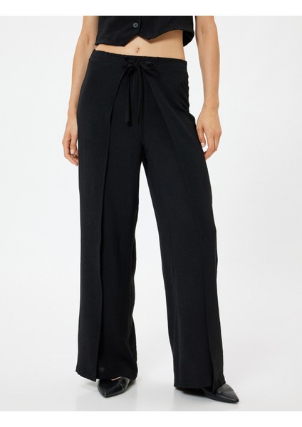 Yandan Kapak Detaylı Bol Paça Pantolon Bağlamalı Aerobin Kumaş modelleri
