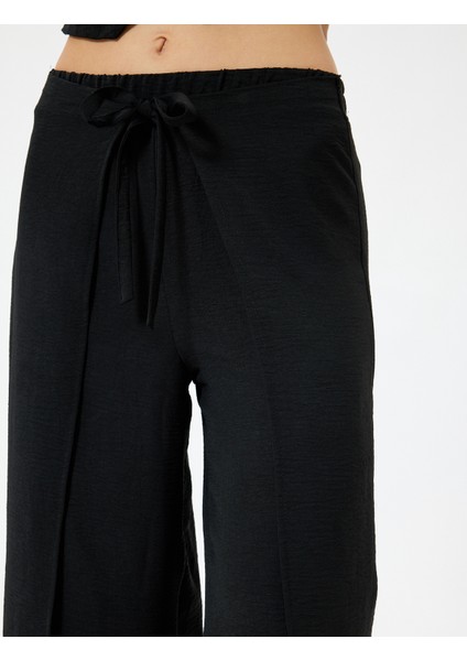 Yandan Kapak Detaylı Bol Paça Pantolon Bağlamalı Aerobin Kumaş indirimleri