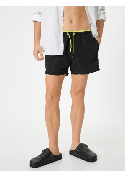 Kısa Deniz Şortu File Astarlı Beli Bağlamalı Cepli Rahat Kalıp modelleri