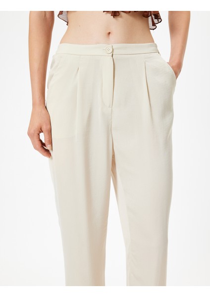 Havuç Kesim Kumaş Pantolon Aerobin Saten Cepli Pile Detaylı indirimleri