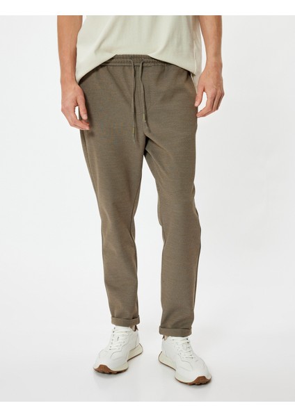 Beli Bağcıklı Pantolon Cep Detaylı Katlamalı Paça modelleri