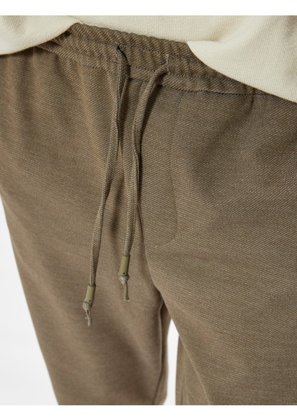 Beli Bağcıklı Pantolon Cep Detaylı Katlamalı Paça indirimleri