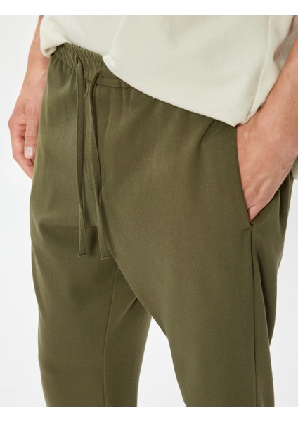 Beli Bağcıklı Pantolon Cep Detaylı indirimleri