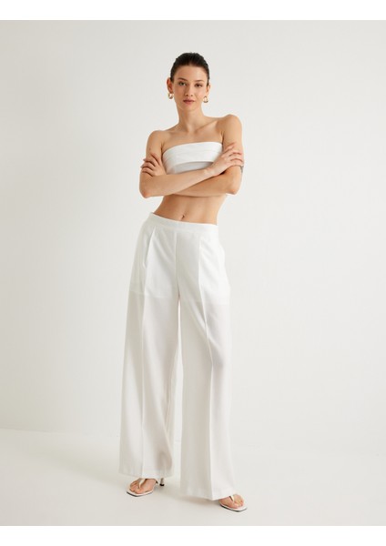 x Melis Ağazat - Geniş Paça Pantolon Tensel Kumaş Yarım Astarlı Pile Detaylı Cepli fiyatları