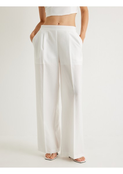 x Melis Ağazat - Geniş Paça Pantolon Tensel Kumaş Yarım Astarlı Pile Detaylı Cepli modelleri