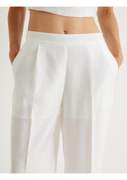 x Melis Ağazat - Geniş Paça Pantolon Tensel Kumaş Yarım Astarlı Pile Detaylı Cepli indirimleri