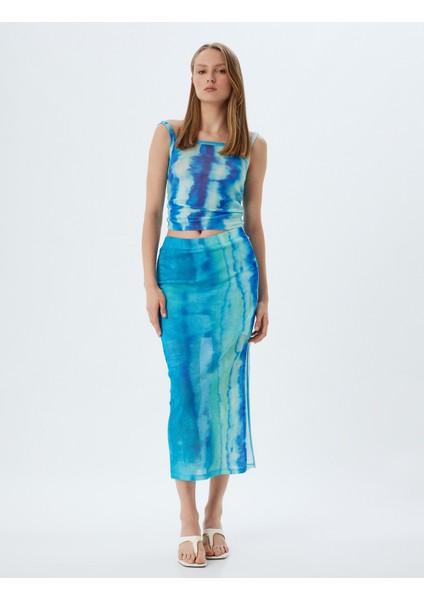 x Şahika Ercümen - Midi Boy Etek Batik Desenli Yandan Yırtmaç Detaylı fiyatları