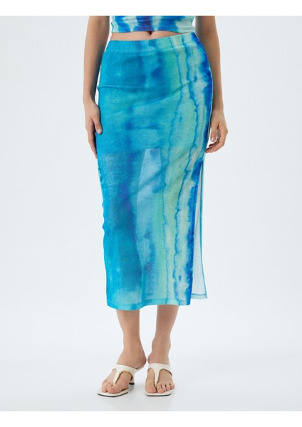 x Şahika Ercümen - Midi Boy Etek Batik Desenli Yandan Yırtmaç Detaylı modelleri