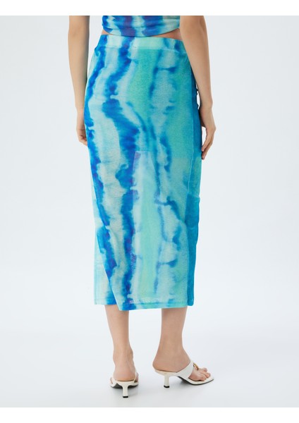 x Şahika Ercümen - Midi Boy Etek Batik Desenli Yandan Yırtmaç Detaylı fırsatları