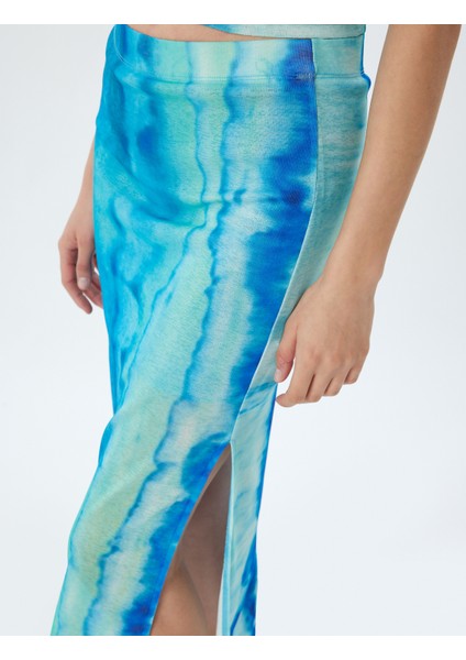 x Şahika Ercümen - Midi Boy Etek Batik Desenli Yandan Yırtmaç Detaylı indirimleri