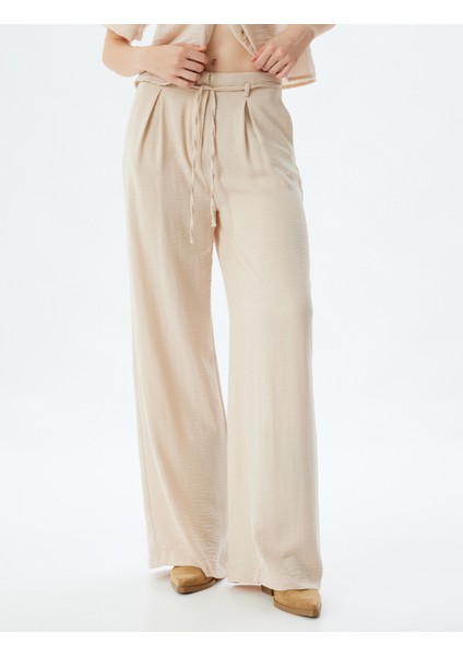 Geniş Paça Pantolon Düğmeli Beli Bağcıklı Normal Bel modelleri