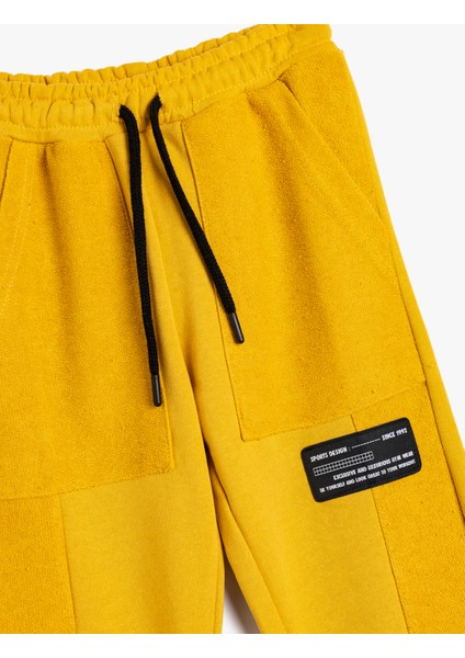 Jogger Eşofman Altı Cepli Beli Bağlamalı Aplike Detaylı modelleri