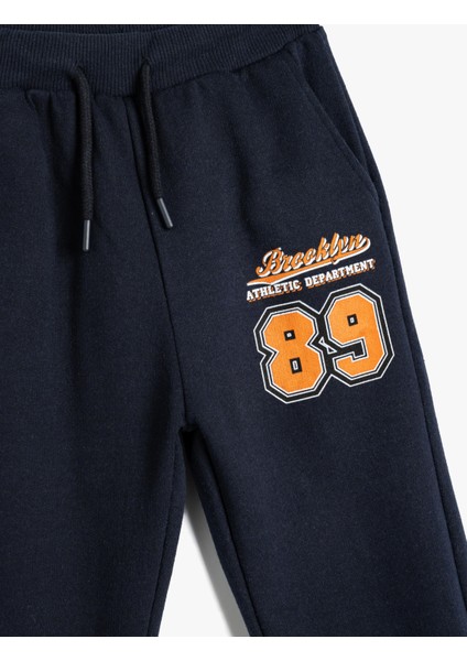 Jogger Eşofman Altı Beli Bağlamalı Spor Baskı Detaylı modelleri