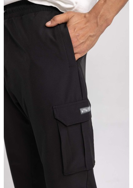 Fit Sporcu Jogger Eşofman Altı Standart Fit Kargo Cepli Dokuma Beli Paçası Lastikli C0043AX24SP