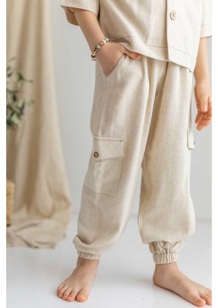 Bej Keten Beli ve Paçaları Lastikli Düğmeli Cep Detaylı Erkek Çocuk Pantolon