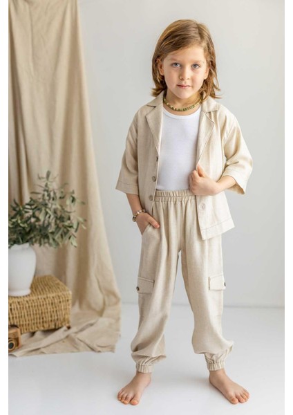 Bej Keten Beli ve Paçaları Lastikli Düğmeli Cep Detaylı Erkek Çocuk Pantolon modelleri