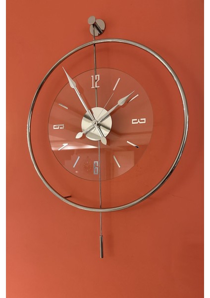 Modern büyük cam duvar saati, gümüş renk, şeffaf tasarım, 60x80 cm, şık dekorasyon.