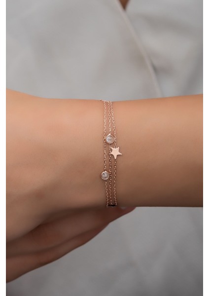 Pembe zirkon taşlı 925 ayar gümüş yıldız bileklik, şık ve zarif tasarım