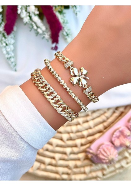 Şık 3'lü metal bileklik seti, altın rengi, modern tasarım, zarif aksesuar.