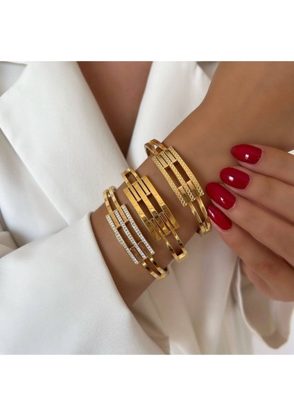 Altın renkli çelik kaburga kelepçe bileklik, şık ve dayanıklı tasarım