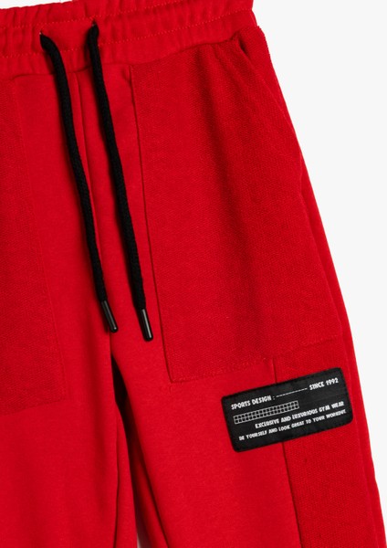 Jogger Eşofman Altı Cepli Beli Bağlamalı Aplike Detaylı modelleri