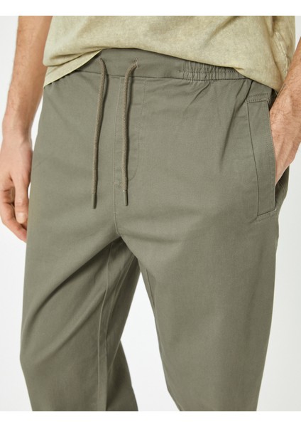 Jogger Pantolon Slim Fit Chino Beli Bağcıklı Cep Detaylı indirimleri