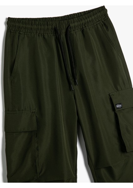 Kargo Cepli Pantolon Jogger Beli Bağcıklı Etiket Detaylı modelleri