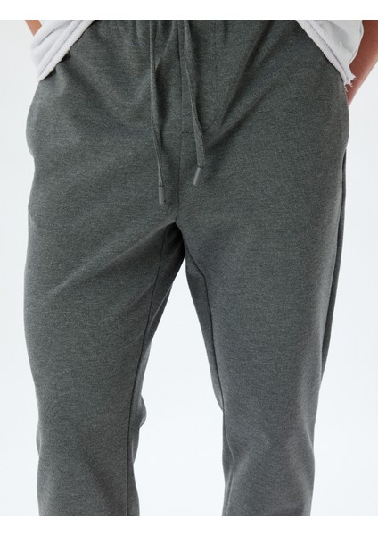 Beli Bağcıklı Pantolon Cep Detaylı indirimleri