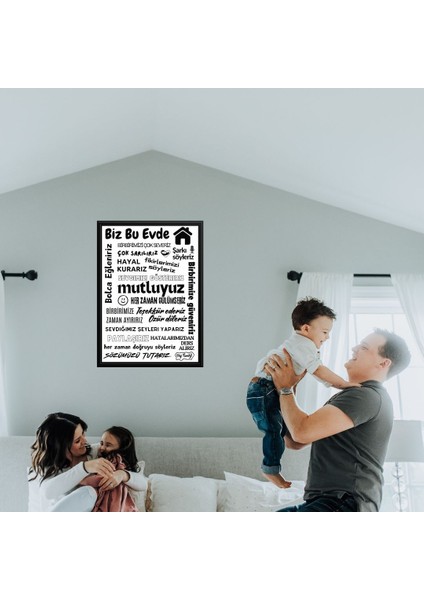 Bu Evde Her Zaman Gülümseriz Yazısı (Siyah Çerçeve Görünümlü) Beyaz Zemin Siyah Yazılı 40 x 55 cm Pvc 1mm