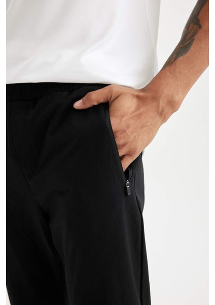 Fit Dokuma Sporcu Jogger Eşofman Altı Slim Fit Dar Kesim Çift Cepli C1212AX24AU