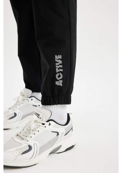 Fit Dokuma Sporcu Jogger Eşofman Altı Slim Fit Dar Kesim Çift Cepli C1212AX24AU