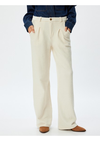 Tüvit Pantolon Bol Paça Yüksek Bel Pileli Düğmeli Cep Detaylı modelleri