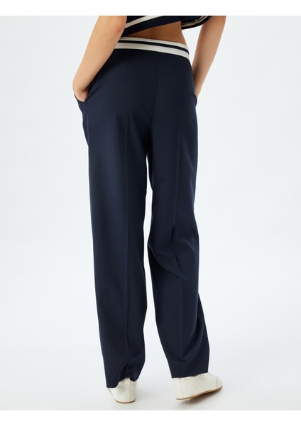 Asimetrik Ters Bel Detaylı Kumaş Pantolon Geniş Paça Cepli fırsatları