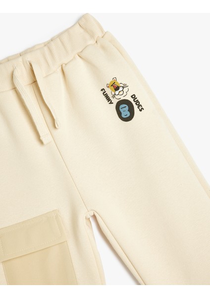 Jogger Eşofman Altı Beli Bağlamalı Baskılı Cep Detaylı Şardonlu modelleri