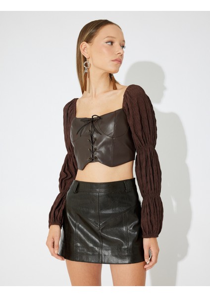 x Zeynep Bastık - Suni Deri Crop Bluz Dokulu Balon Uzun Kol Kalp Yaka Bağlamalı Slim Fit modelleri