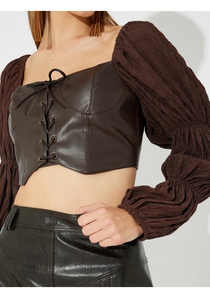 x Zeynep Bastık - Suni Deri Crop Bluz Dokulu Balon Uzun Kol Kalp Yaka Bağlamalı Slim Fit indirimleri