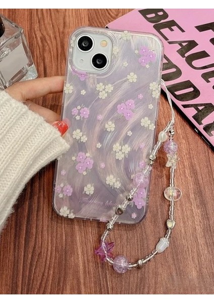 iPhone 15 Plus Uyumlu Lila Çiçekli Desenli Boncuklu Bilek Askılı Charmlı Kılıf