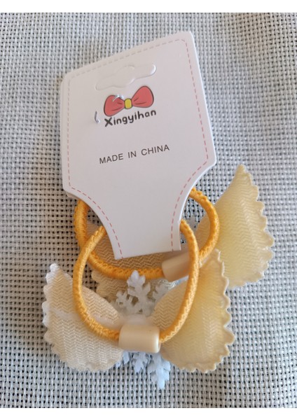 Üzeri Simli Kar Tanesi ve Kristal Taş Süslemeli Melek Kanat Model Çiftli Çocuk Lastik Toka modelleri