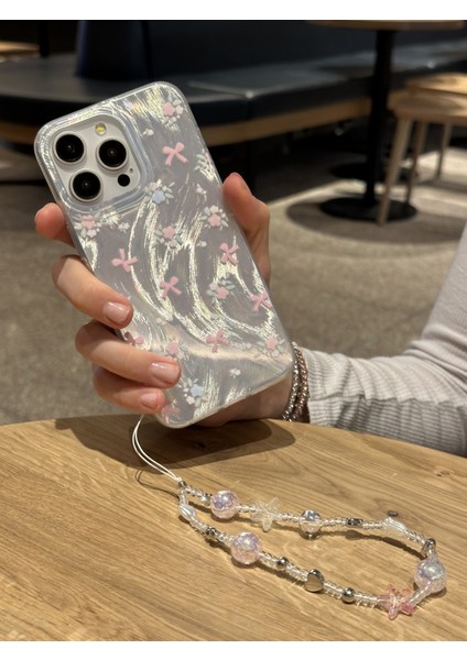 iPhone 15 Pro Max Uyumlu Kurdeleli Çiçekli Desenli Boncuklu Bilek Askılı Charmlı Kılıf