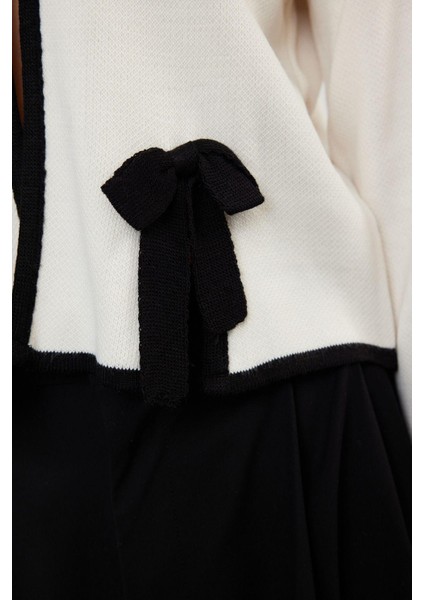 Kadın Moda Şık Crop Bisiklet Yaka Regular Kurdele Fiyonk Detaylı Ceket Görünümlü Triko Hırka indirimleri